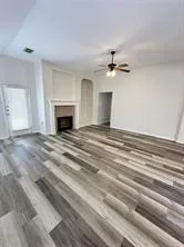 a view of an empty room with a fireplace