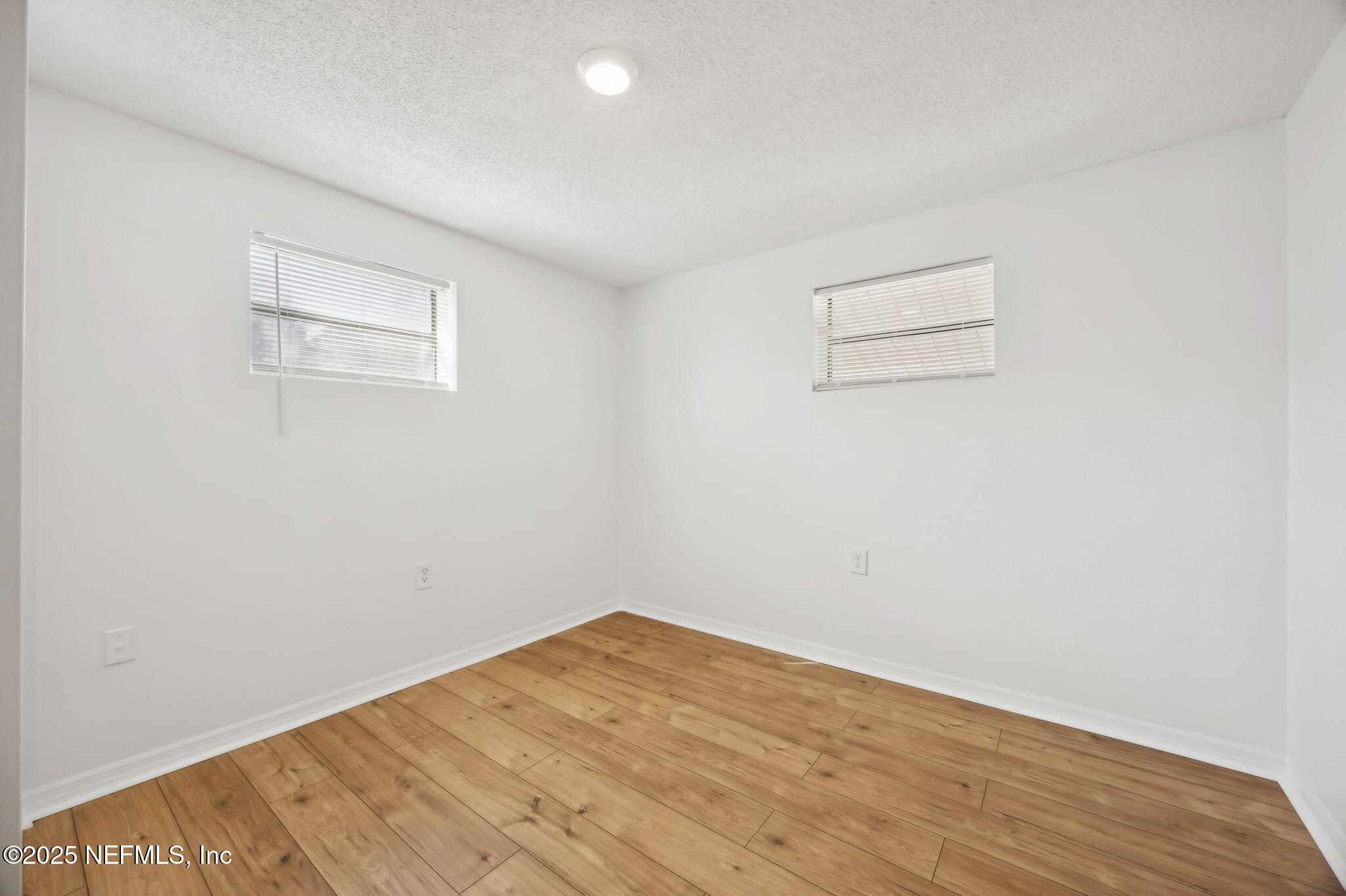 44186 Lee Drive Callahan, FL 32011 - Photo 11 of 28 a view of empty room with wooden floor
