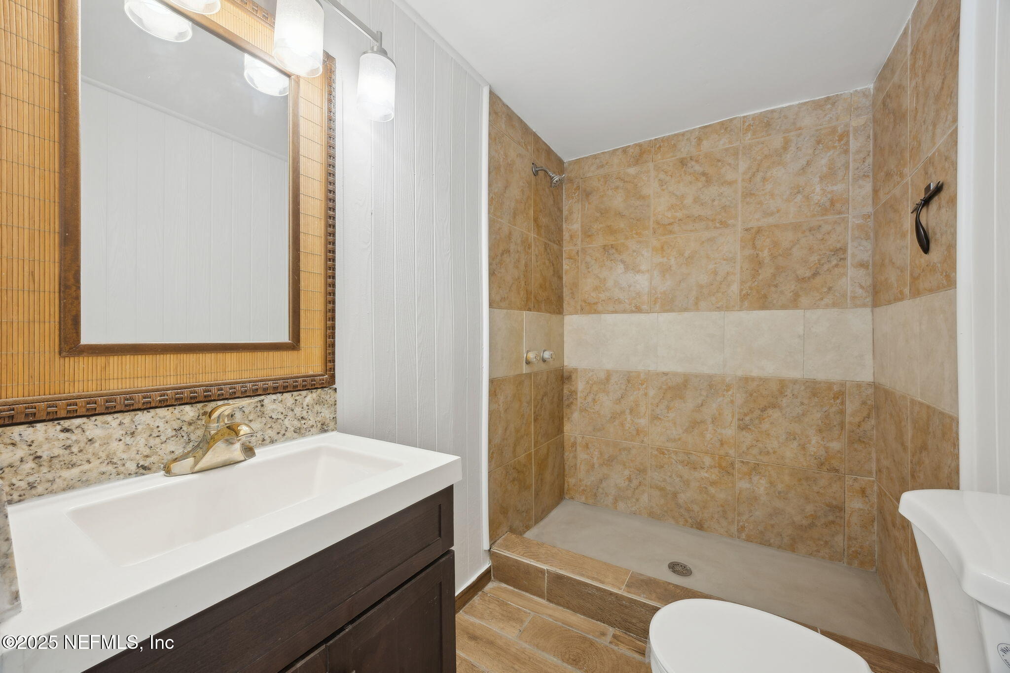 44186 Lee Drive Callahan, FL 32011 - Photo 13 of 28 a bathroom with a sink toilet and shower