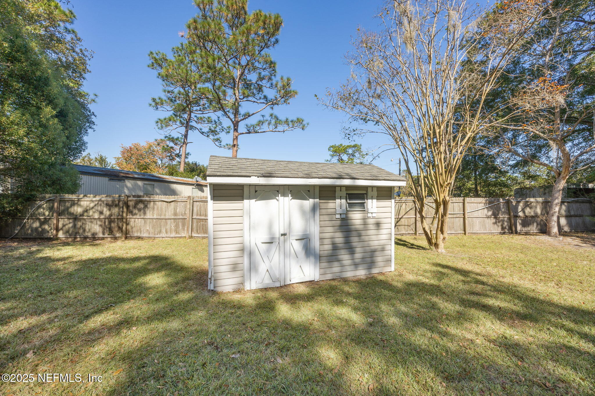 44186 Lee Drive Callahan, FL 32011 - Photo 25 of 28 a view of a yard with plants and trees