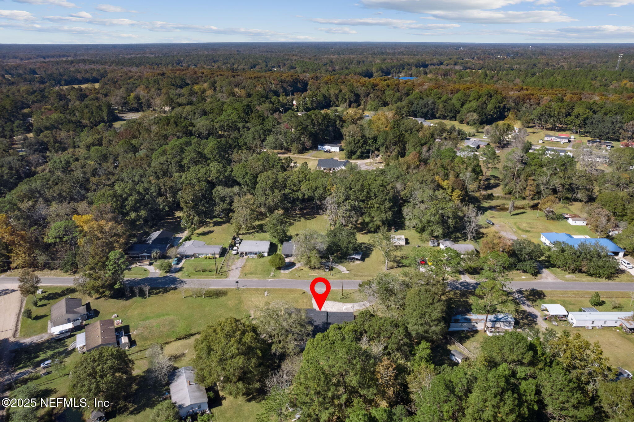 44186 Lee Drive Callahan, FL 32011 - Photo 26 of 28 an aerial view of residential houses with outdoor space and trees