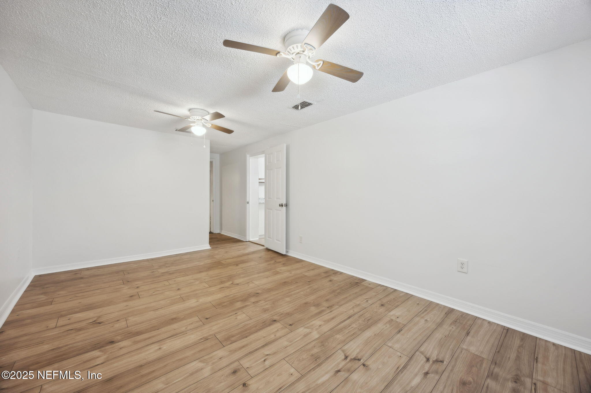 44186 Lee Drive Callahan, FL 32011 - Photo 9 of 28 wooden floor in an empty room
