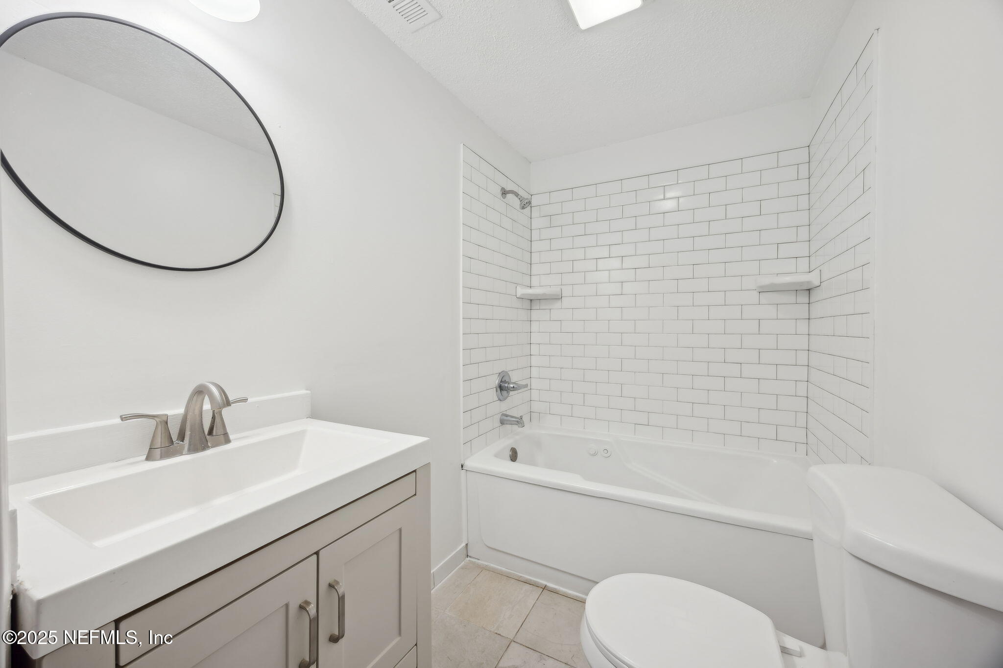44186 Lee Drive Callahan, FL 32011 - Photo 10 of 28 a bathroom with a sink a toilet and a mirror