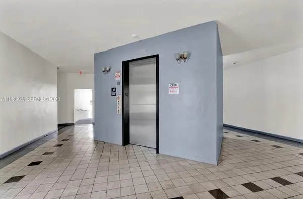 a view of a hallway with closet