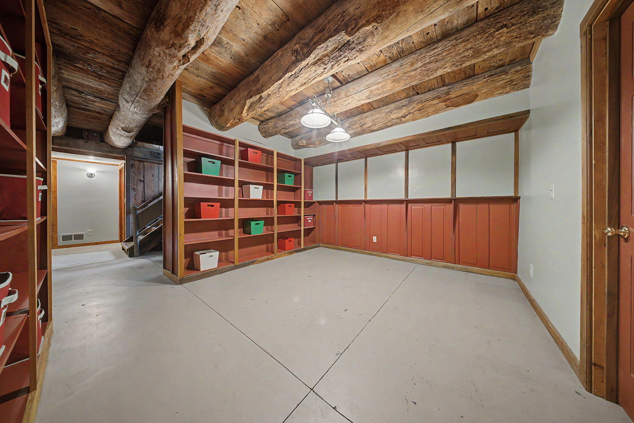 9766 Sullivan Road Union, KY 41091 - Photo 37 of 50 The beech and oak tree trunks, visible in the basement ceiling, serve as beams for original hay press barn pine floor, which is secured with hand forged iron nails