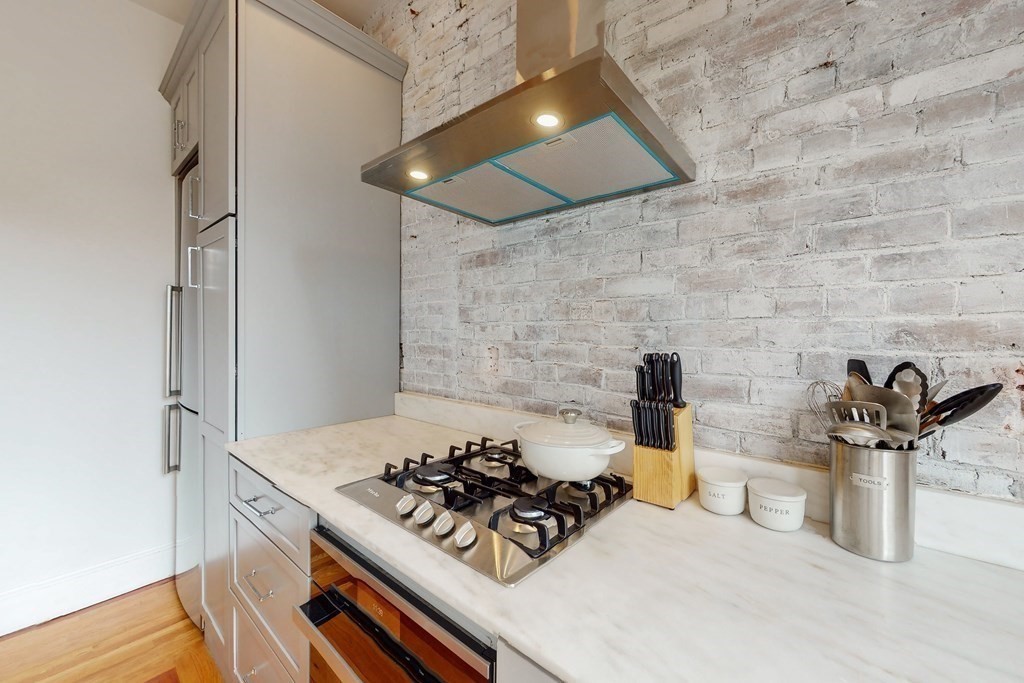 405 Marlborough Street, Unit 41 Boston, MA 02115 - Photo 15 of 32 a kitchen with a stove and a sink