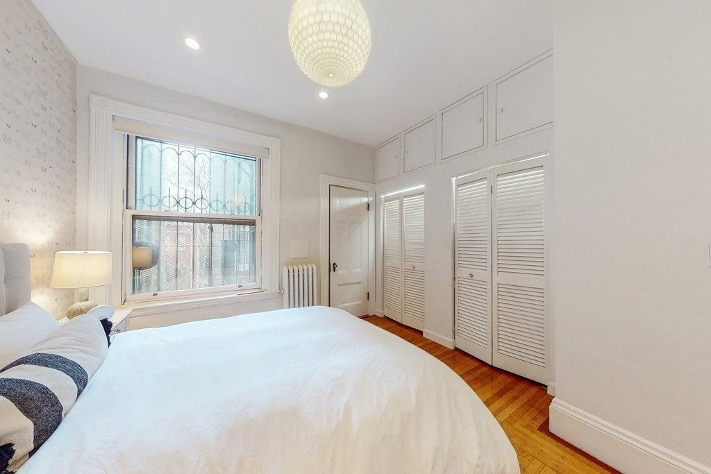 405 Marlborough Street, Unit 41 Boston, MA 02115 - Photo 18 of 32 a bedroom with a bed and a window
