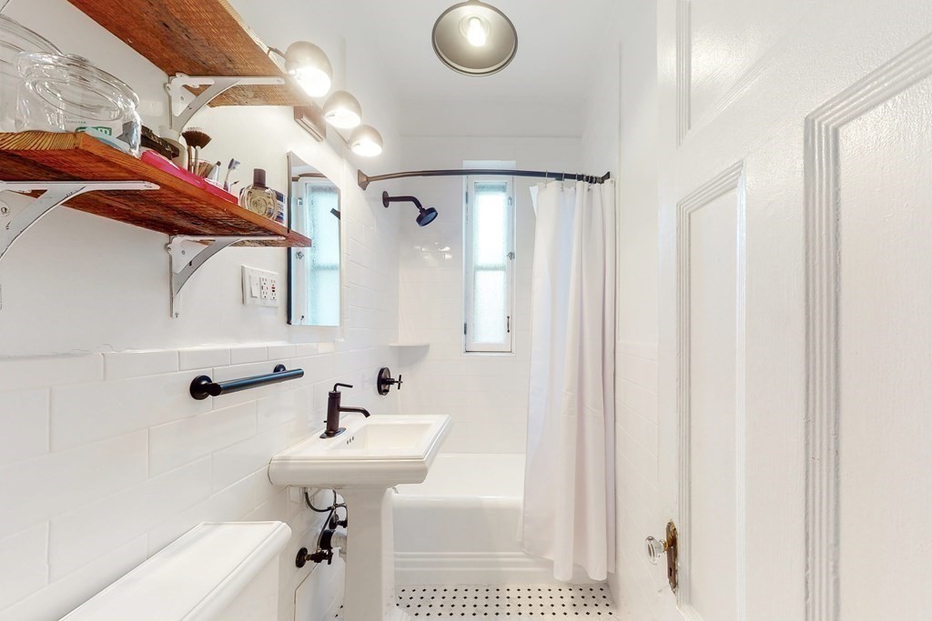 405 Marlborough Street, Unit 41 Boston, MA 02115 - Photo 20 of 32 a bathroom with a sink a toilet and shower