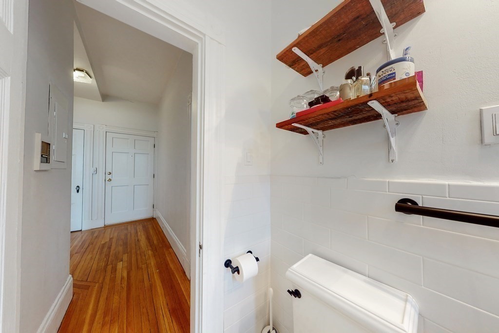 405 Marlborough Street, Unit 41 Boston, MA 02115 - Photo 21 of 32 a view of a room with racks on the wall