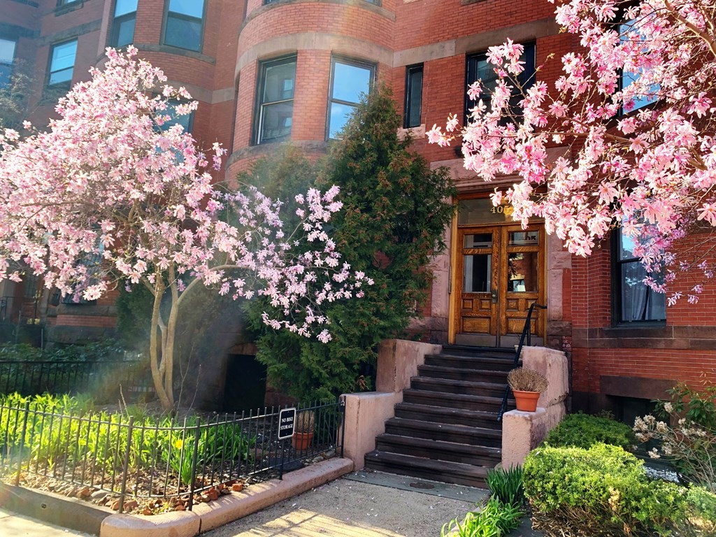 405 Marlborough Street, Unit 41 Boston, MA 02115 - Photo 30 of 32 a front view of a house with a yard and outdoor seating