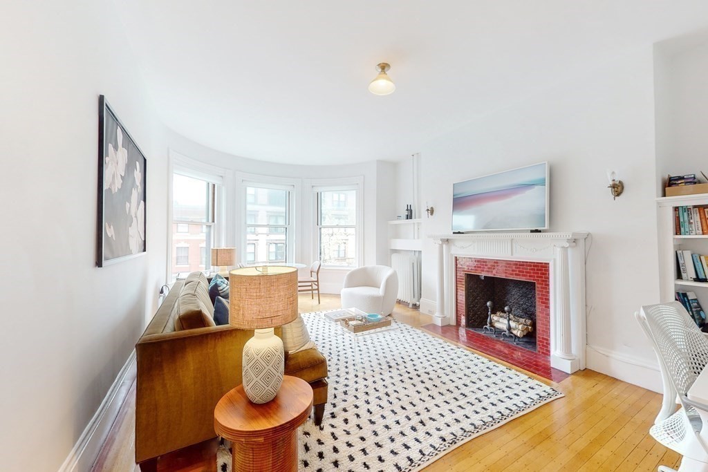 405 Marlborough Street, Unit 41 Boston, MA 02115 - Photo 5 of 32 a living room with furniture and a fireplace