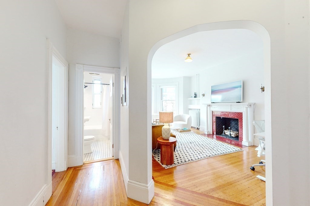 405 Marlborough Street, Unit 41 Boston, MA 02115 - Photo 9 of 32 a living room with furniture and a fireplace