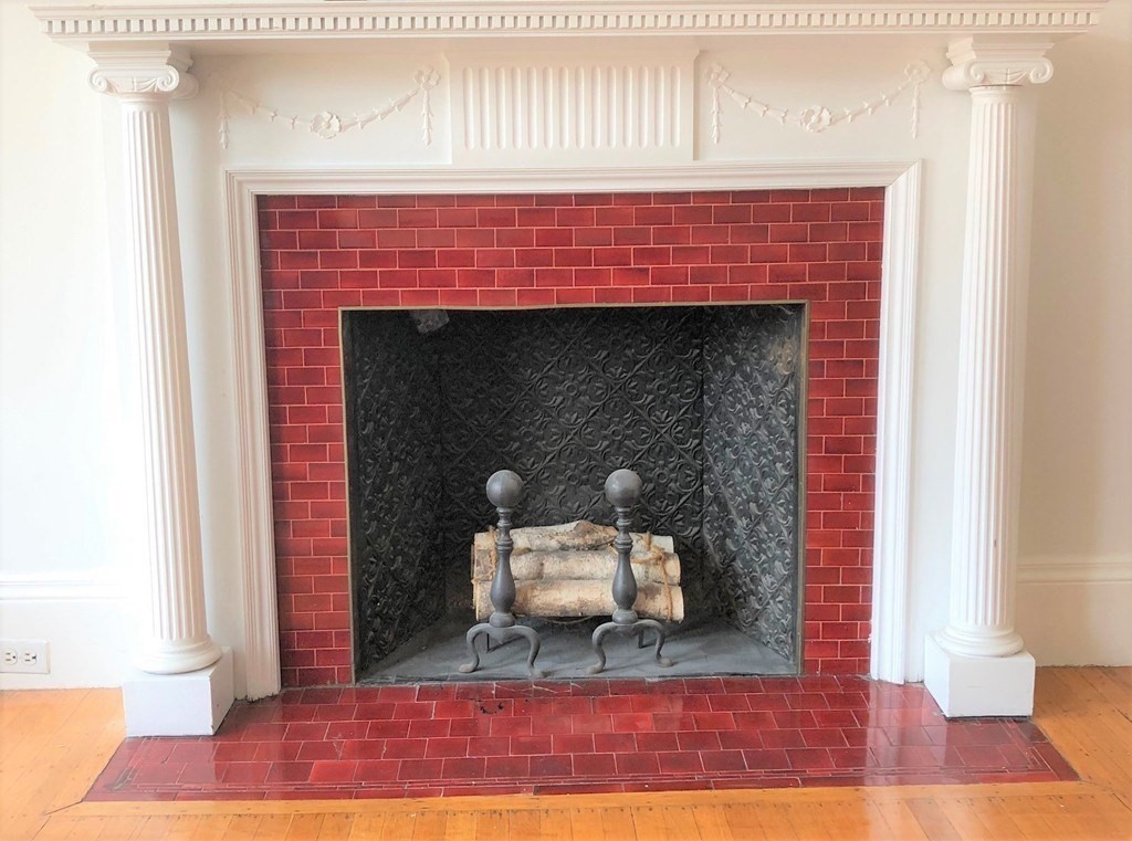405 Marlborough Street, Unit 41 Boston, MA 02115 - Photo 10 of 32 a living room with furniture and a fireplace