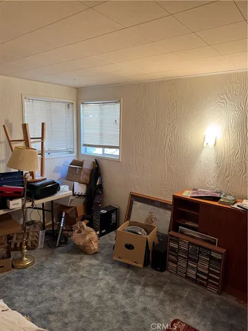 a bathroom with a sink and mirror with bathtub