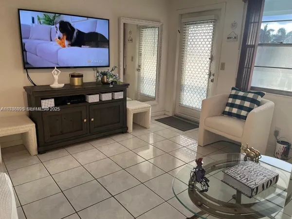 a living room with furniture and a window