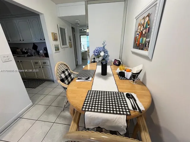 a bedroom with furniture and a rug