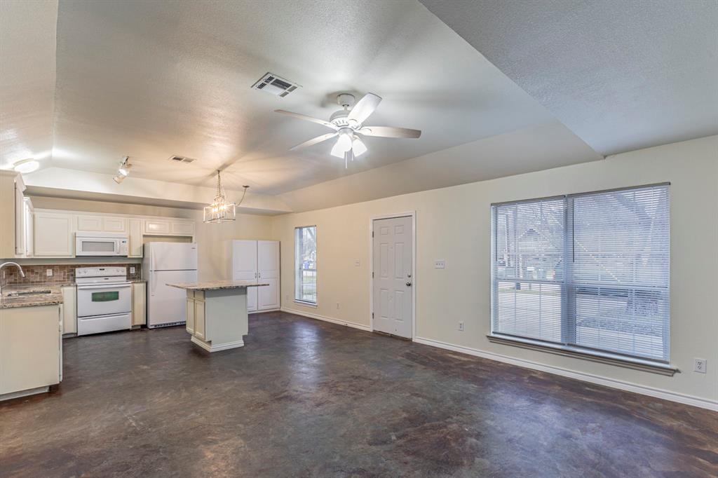 1923 South 15th Street Waco, TX 76706 - Photo 3 of 16 a view of a kitchen with a sink and a stove top oven