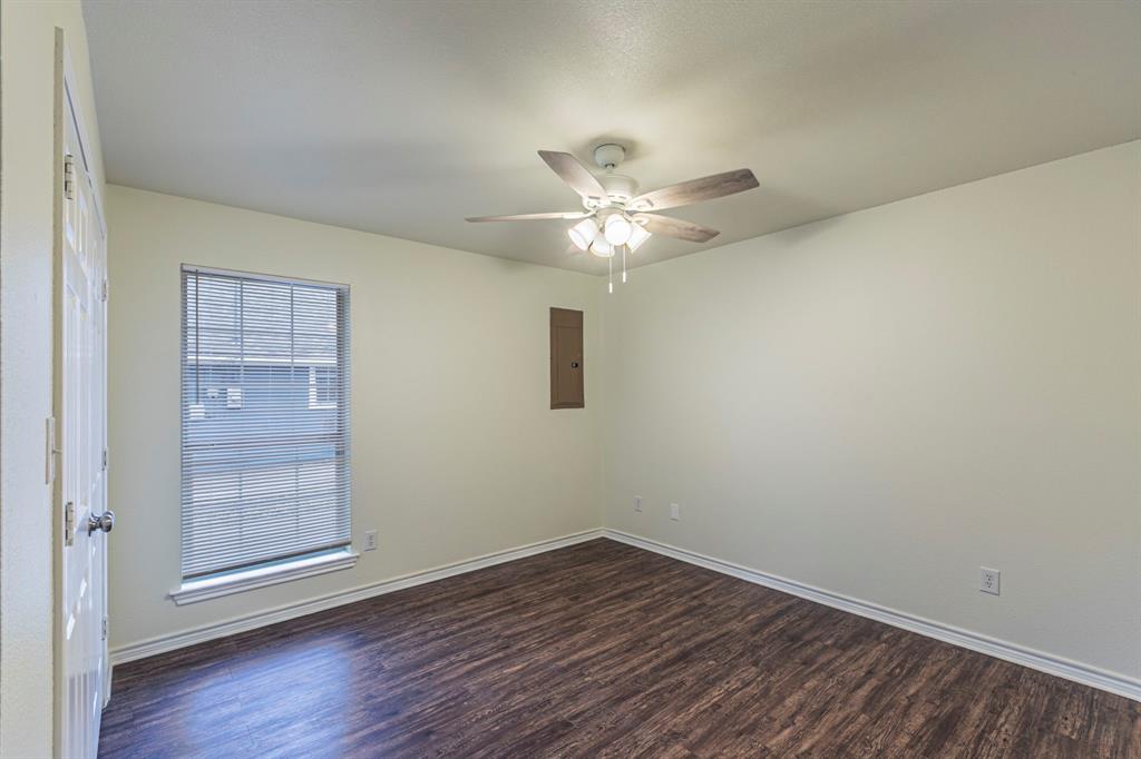 1923 South 15th Street Waco, TX 76706 - Photo 6 of 16 wooden floor in an empty room with a window