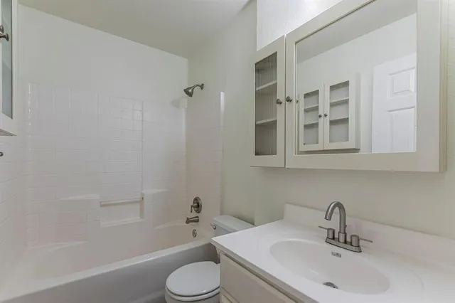 a bathroom with a sink toilet and bathtub