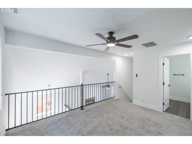 a view of a livingroom with a ceiling fan
