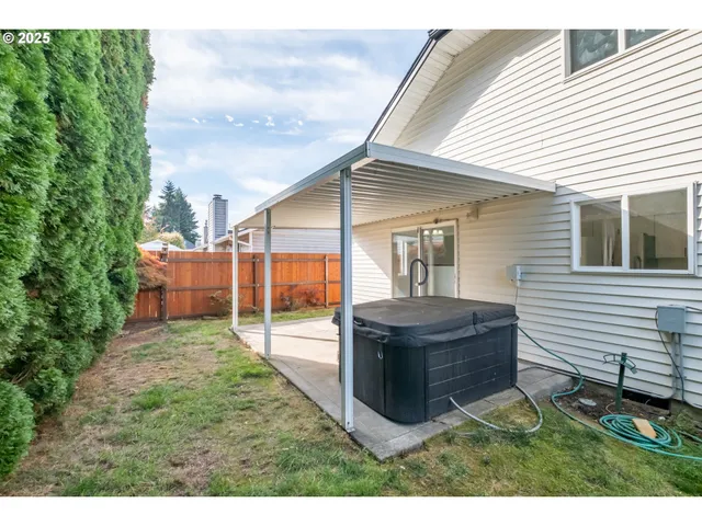 a view of a house with backyard and porch