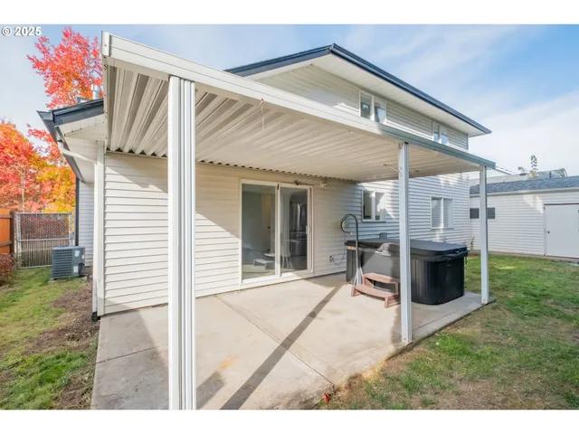 a view of backyard with small cabin