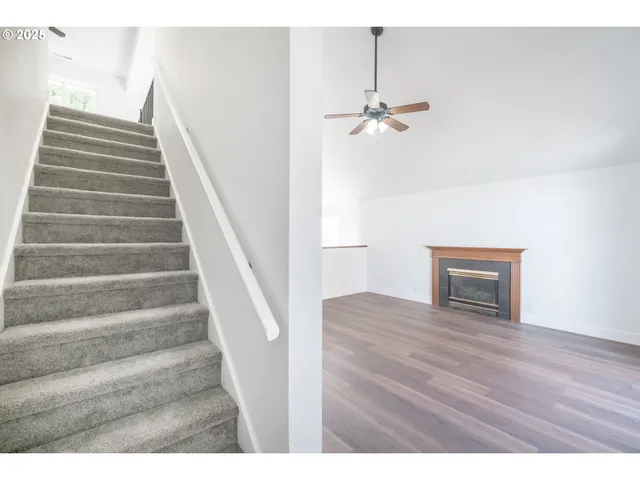 a view of an entryway with wooden floor