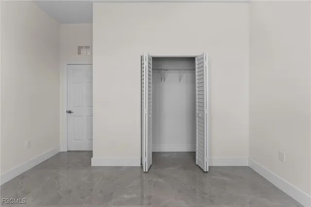 an empty room with closet