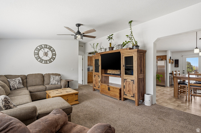 1637 East Midvalley Road Enoch, UT 84721 - Photo 4 of 48 Carpeted living room featuring a ceiling fan