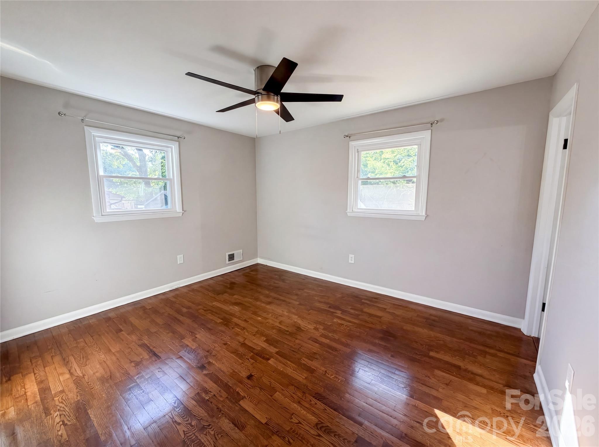 2375 Saw Road China Grove, NC 28023 - Photo 11 of 18 a view of an empty room with wooden floor and a window
