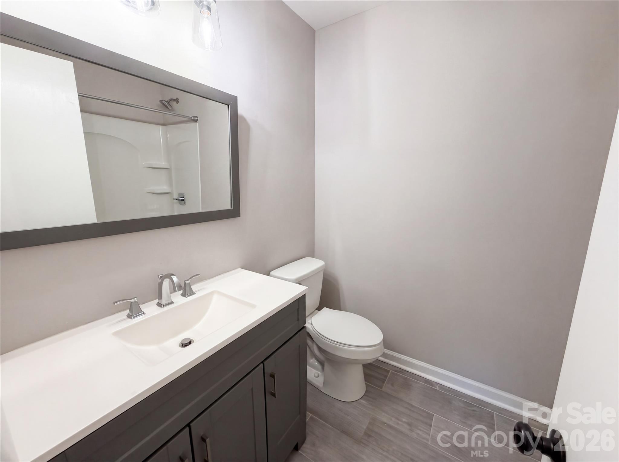 2375 Saw Road China Grove, NC 28023 - Photo 13 of 18 a bathroom with a sink a toilet and mirror