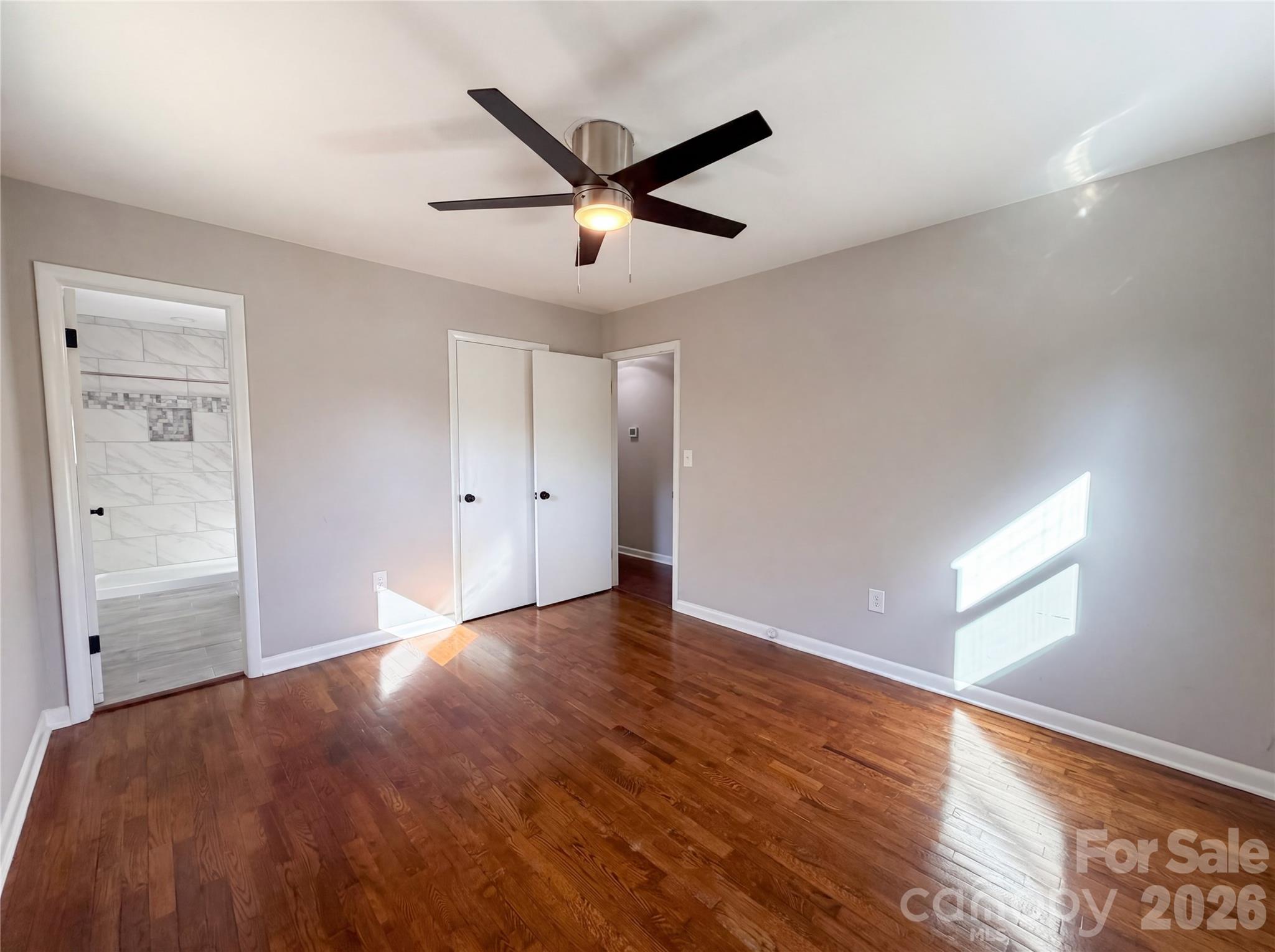 2375 Saw Road China Grove, NC 28023 - Photo 8 of 18 a view of a livingroom with a ceiling fan and wooden floor