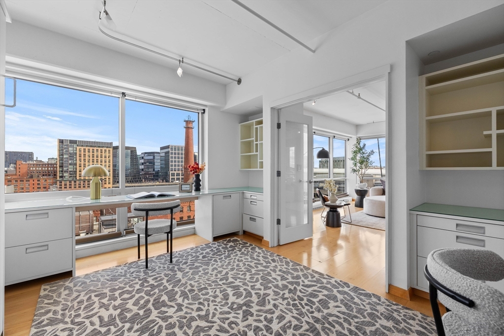 25 Channel Center Street, Unit 1102 Boston, MA 02210 - Photo 14 of 28 a room with a workspace and a window