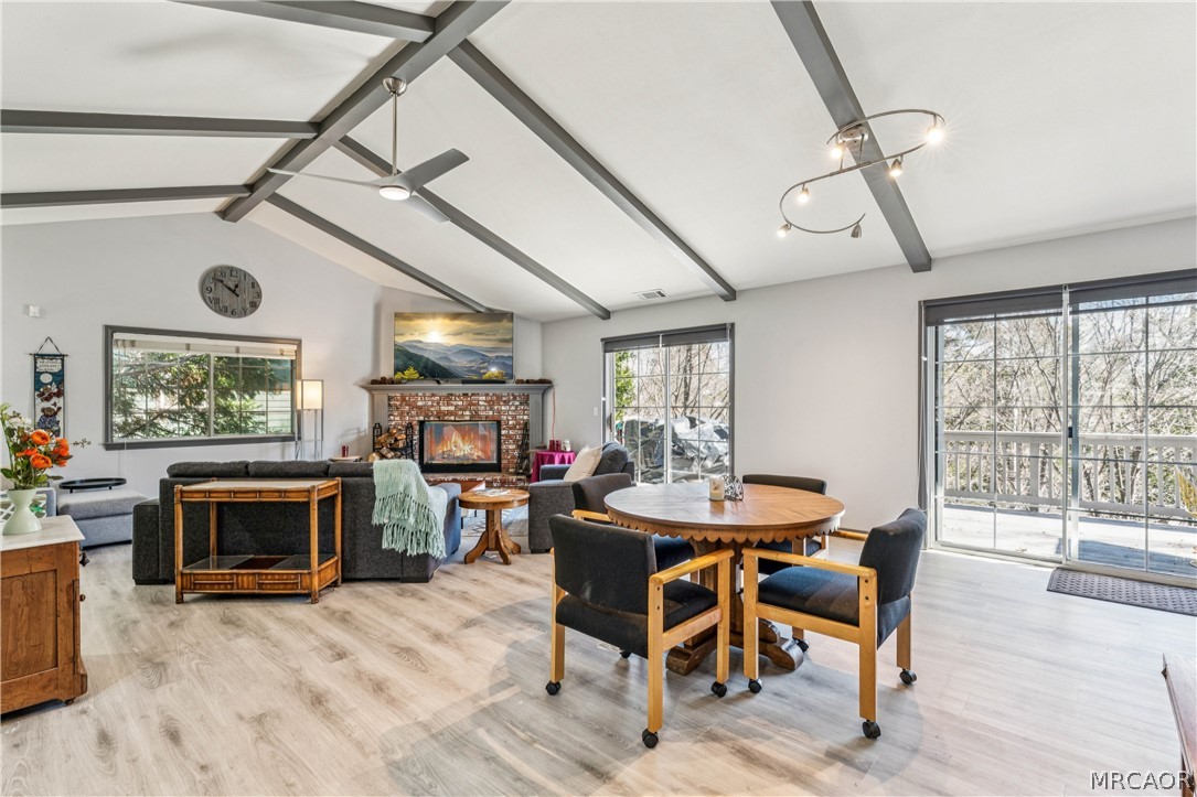 27487 North Bay Road Lake Arrowhead, CA 92352 - Photo 9 of 35 Spacious living & dining area, deck access, vaulted ceilngs - fire is photoshopped