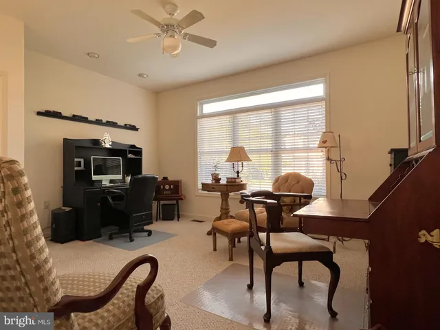 a spacious bedroom with two beds and a couch