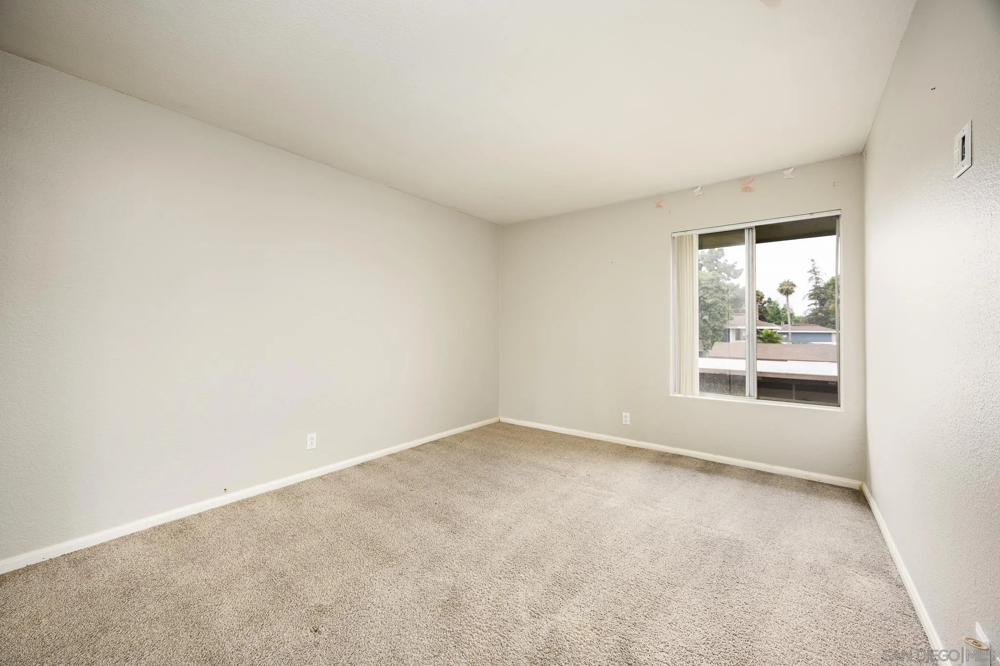 615 Fredricks Avenue, Unit 134 Oceanside, CA 92058 - Photo 19 of 40 an empty room with a window
