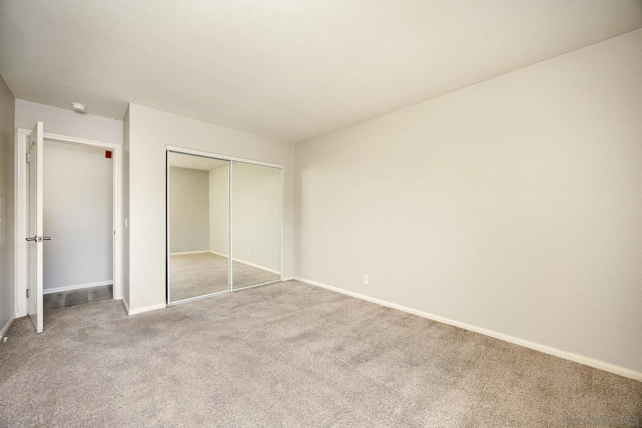 615 Fredricks Avenue, Unit 134 Oceanside, CA 92058 - Photo 20 of 40 an empty room with a natural light