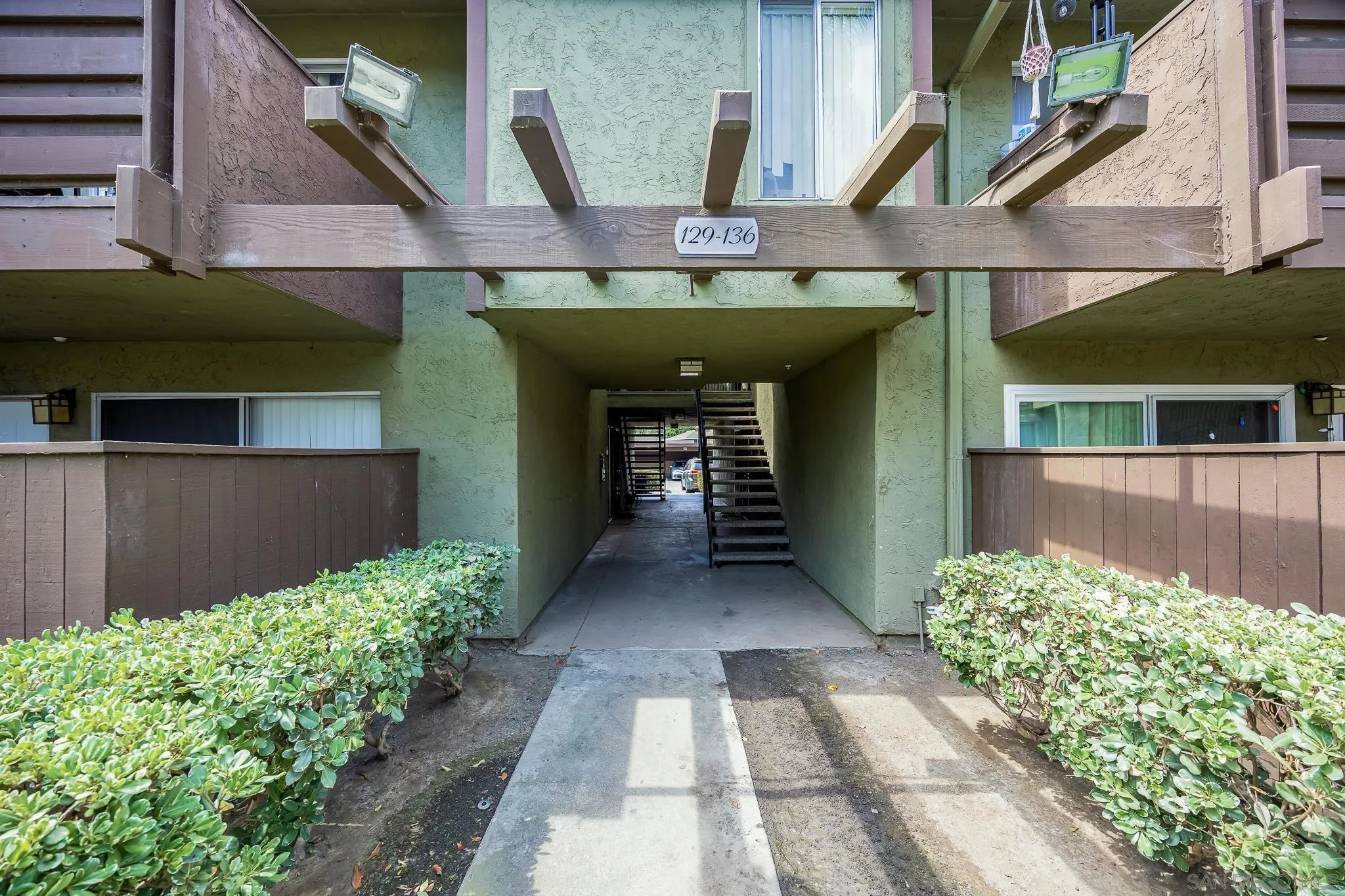 615 Fredricks Avenue, Unit 134 Oceanside, CA 92058 - Photo 2 of 40 a front view of a house with garden
