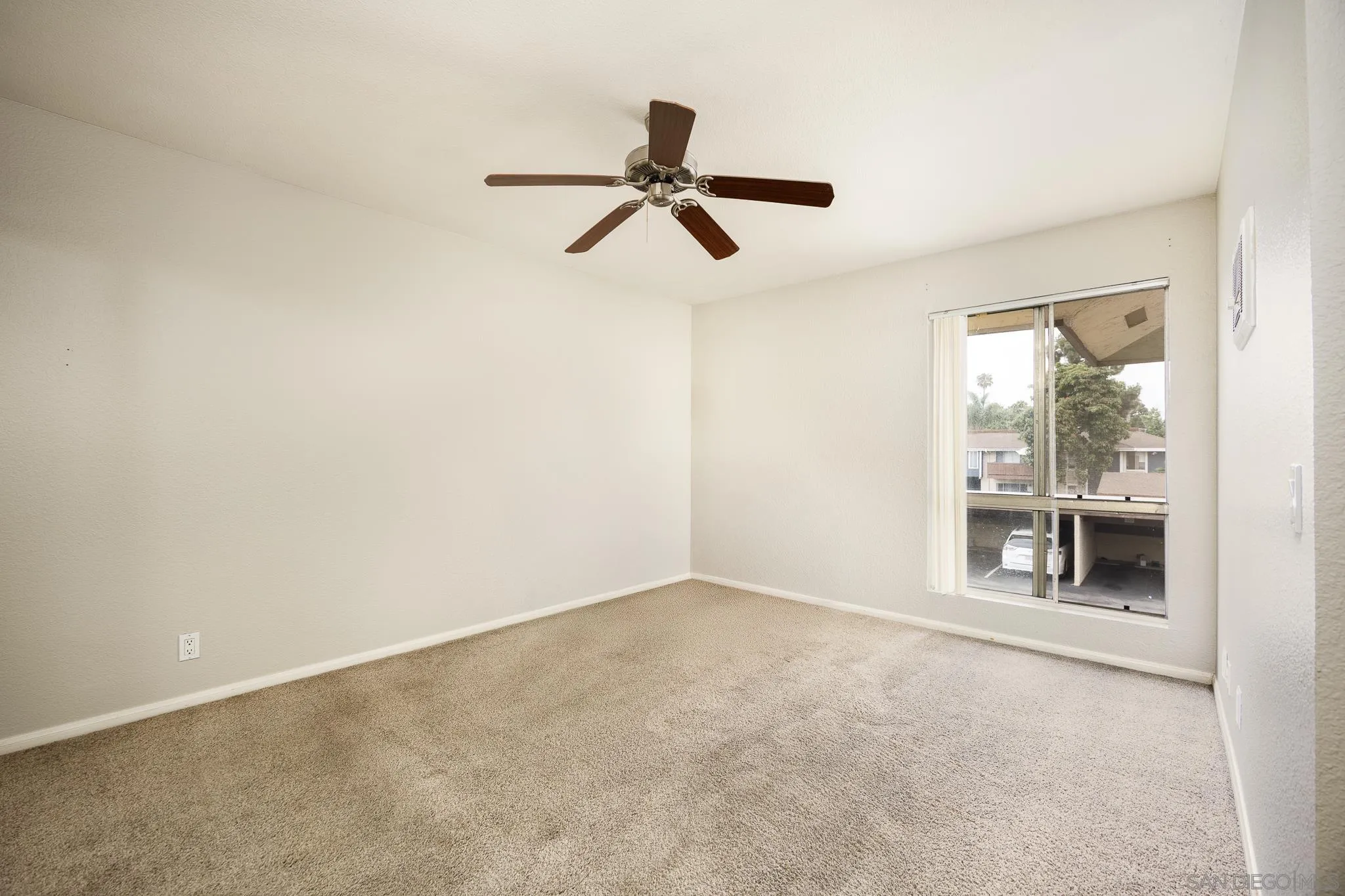 615 Fredricks Avenue, Unit 134 Oceanside, CA 92058 - Photo 22 of 40 wooden floor in an empty room and a window