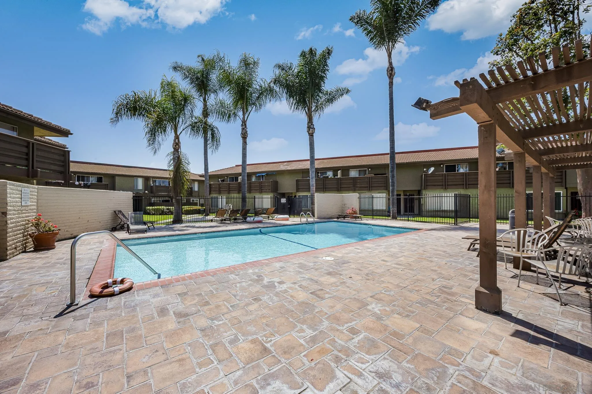 615 Fredricks Avenue, Unit 134 Oceanside, CA 92058 - Photo 29 of 40 a view of a backyard with plants and swimming pool