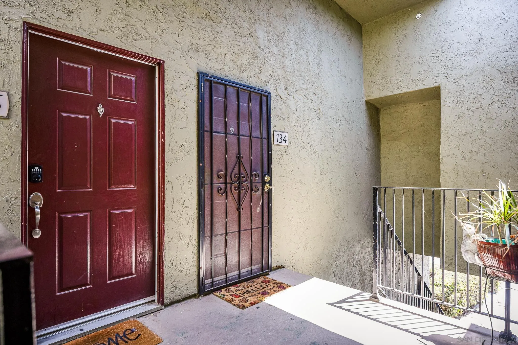 615 Fredricks Avenue, Unit 134 Oceanside, CA 92058 - Photo 3 of 40 a view of a hallway with wooden floor and entryway