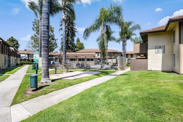 a front view of a house with a yard table and chairs