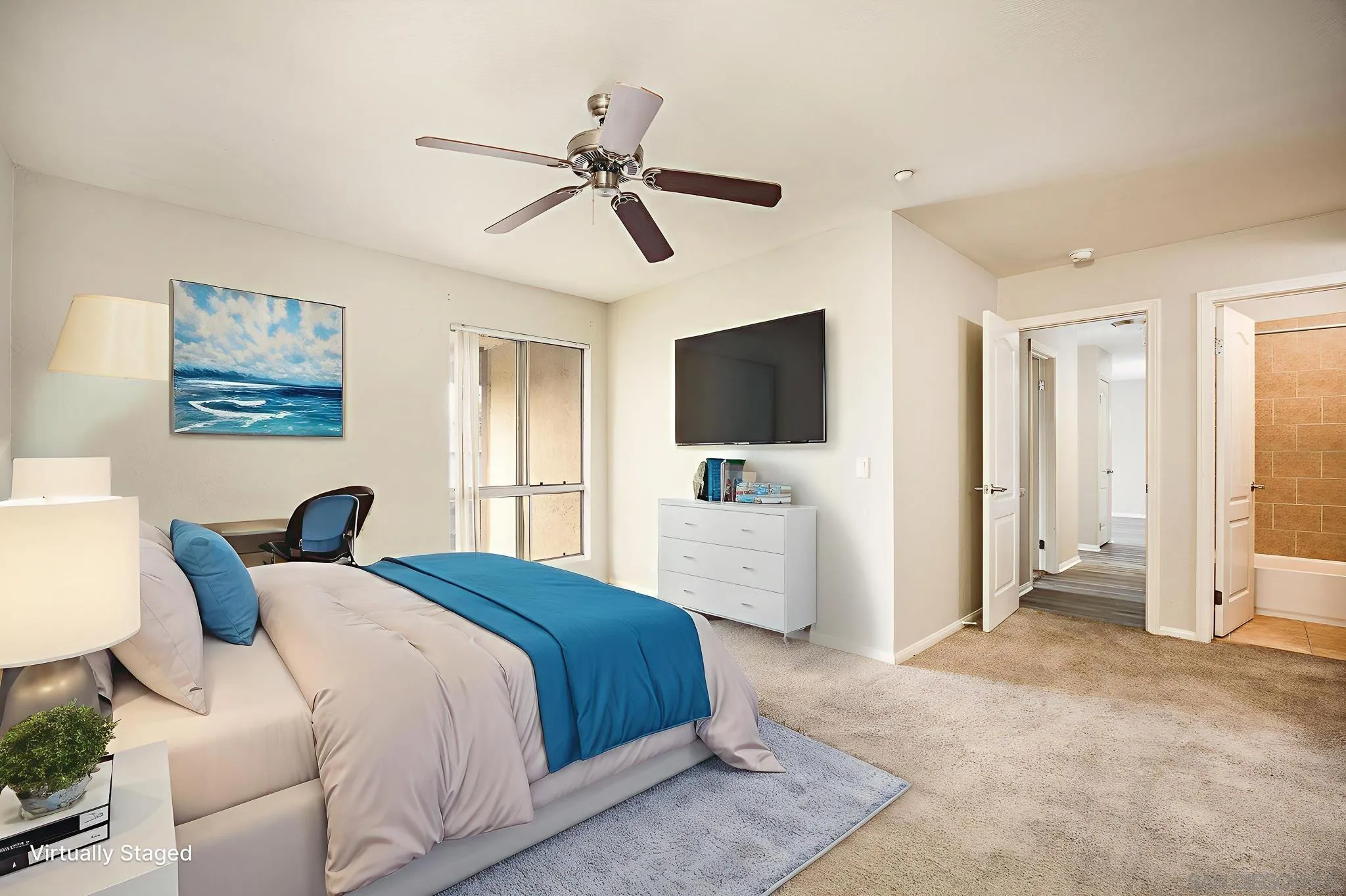 615 Fredricks Avenue, Unit 134 Oceanside, CA 92058 - Photo 10 of 40 a bedroom with a bed and a flat screen tv