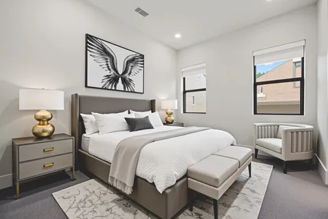 a bedroom with a bed and a couch