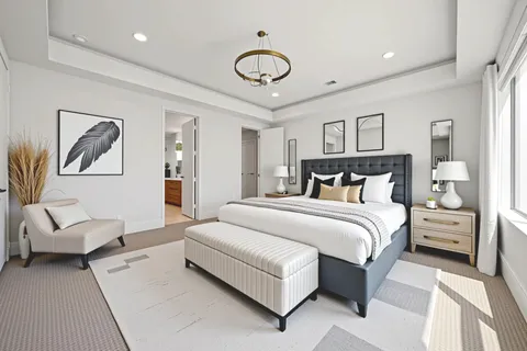 a bedroom with a bed and furniture