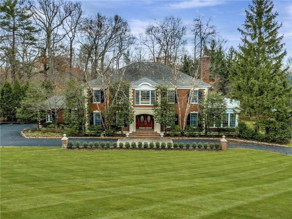 a front view of a house with a swimming pool