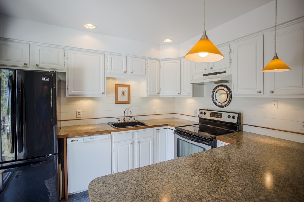 27 Masterson Road Whately, MA 01093 - Photo 6 of 30 a kitchen with stainless steel appliances granite countertop a stove a refrigerator and a sink