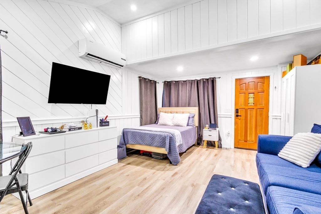 306 Berlin Road Marlborough, MA 01752 - Photo 13 of 36 a bedroom with a bed and a flat screen tv