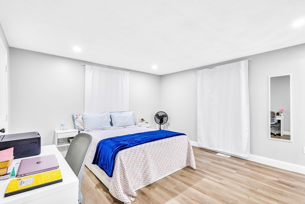 306 Berlin Road Marlborough, MA 01752 - Photo 17 of 36 a bed room with a bed and a couch