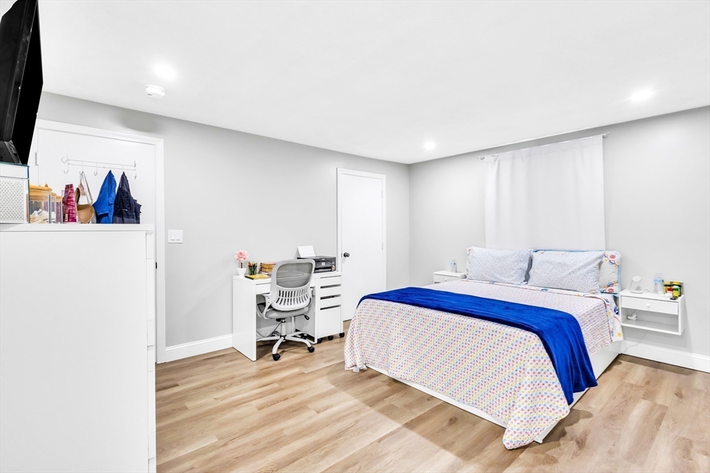 306 Berlin Road Marlborough, MA 01752 - Photo 19 of 36 a bedroom with a bed and a table